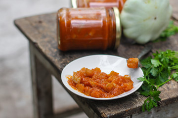 bush pumpkin in tomato sauce (a portion food) - conservation of products. food background