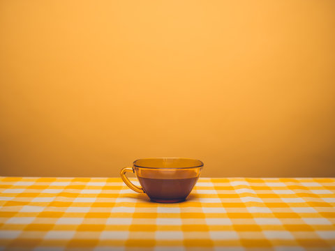 A cup of coffee in a yellow room