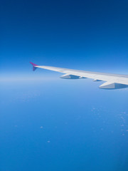 Airplane wing as seen from the passenger's seat.
