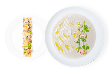 Cream mushroom soup with scallops and some herbs.