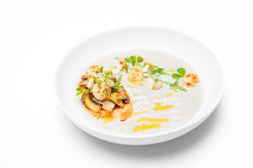 Cream mushroom soup with scallops, herbs and toast bread.