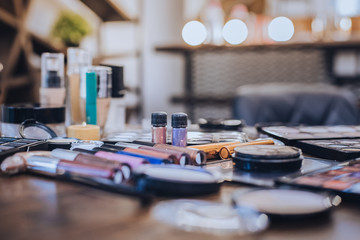 Professional cosmetics. Professional quality cosmetics for top models lying on the table in beauty saloon