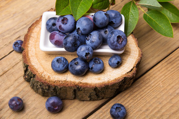 Fresh organic berries on a wooden background.