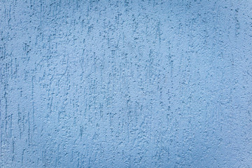 Fototapeta na wymiar Texture of a blue stucco wall, background with a vignette