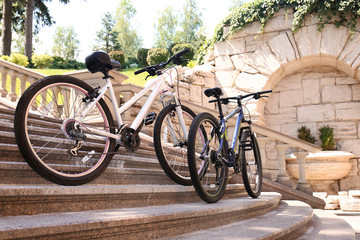 Modern bicycles on stairs outdoors