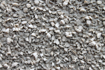 gray wall, covered with small stone crumbs for background