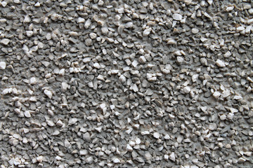 gray wall, covered with small stone crumbs for background