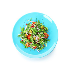 Plate with delicious healthy fresh salad on white background