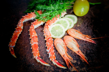 Crab legs on  rustic background