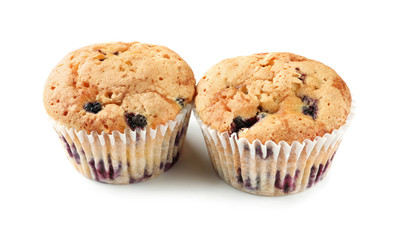 Sweet blueberry muffins on white background