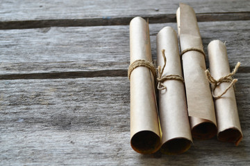 Fototapeta premium Rolls of paper tied with a rope. Free space for text .