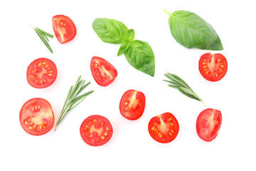 Ripe cherry tomatoes and herbs on white background