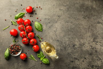 Composition with ripe cherry tomatoes on dark background