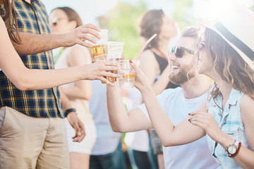 Couple sitting and drinking alcohol at outdoor party 