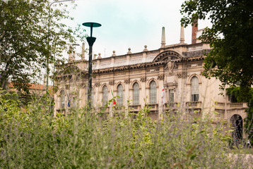 Building of the Polytechnic University of Milan with flora of the square