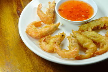 crispy fried shrimp with flour arranging and sweet sauce on plate