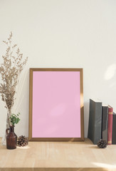 Blank white Photo Frame on Wooden for Design Mockup Template.