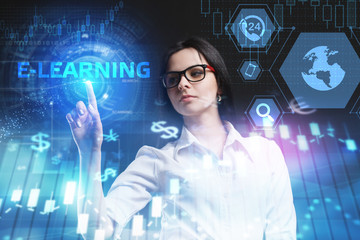 The concept of business, technology, the Internet and the network. A young entrepreneur working on a virtual screen of the future and sees the inscription: E-learning