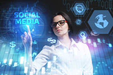 The concept of business, technology, the Internet and the network. A young entrepreneur working on a virtual screen of the future and sees the inscription: Social media