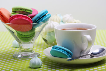 A cup of coffee and macaroons ready for breakfast