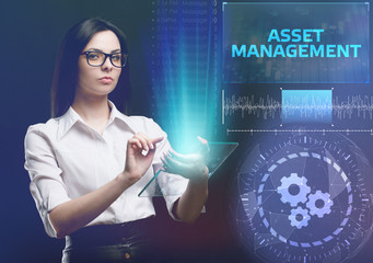 The concept of business, technology, the Internet and the network. A young entrepreneur working on a virtual screen of the future and sees the inscription: Asset management