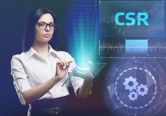 The concept of business, technology, the Internet and the network. A young entrepreneur working on a virtual screen of the future and sees the inscription: CSR