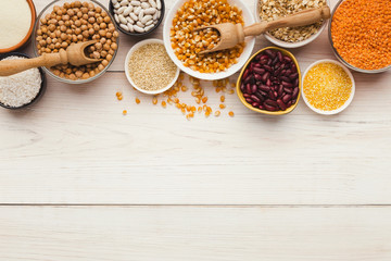 Obraz na płótnie Canvas Cereals and legumes assortment on wooden table