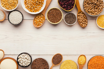 Cereals and legumes assortment on wooden table