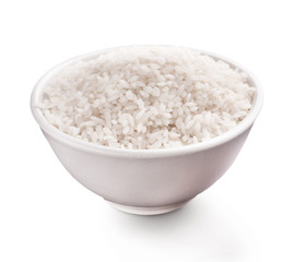 Uncooked white rice in bowl isolated