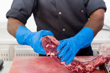 Chef handling Raw Meat