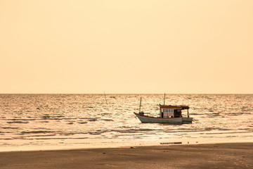 Obraz premium Floating fishing boats aground at the harbor in the sea sunset time at Chanthaburi, Thailand.