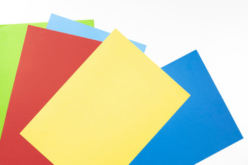 Colourful paper sheets on white background