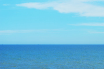 Fototapeta na wymiar Blue sea and Blue clear sky as background