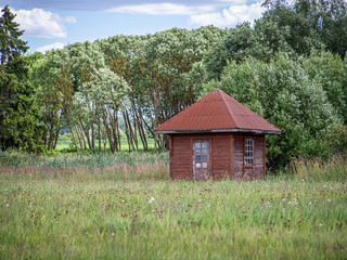 Wooden Cabin in a country side in a sunny day