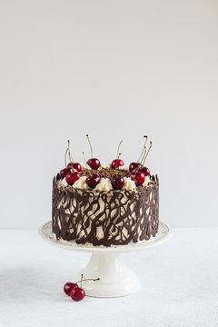 Homemade german cake - Black forest, with chocolate decoration. Light background.