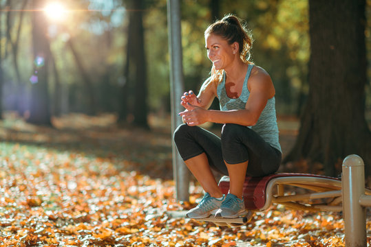 Woman Resting Ater Exercising Outdoors in The Fall