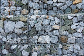 Texture Stone with wire mesh for falling rock protection.Thailand.