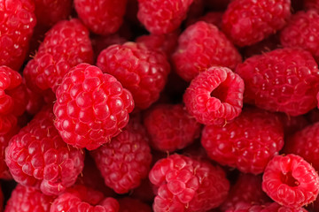 Sweet ripe raspberries as background