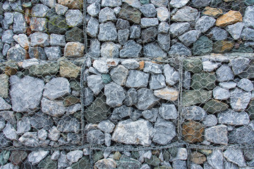 Texture Stone with wire mesh for falling rock protection.Thailand.