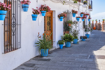 Beautiful view of old Mijas Calle Moro (Moro Street). Mijas (not far from Malaga) - Spanish hill town overlooking the Costa del Sol, known for its white-washed buildings. Mijas, Andalusia, Spain. - obrazy, fototapety, plakaty