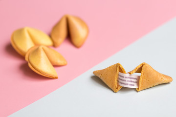 fortune cookie on pink and blue background, pastel colors