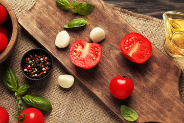 Composition with fresh cherry tomatoes on table