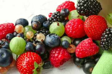 Fototapeta premium Assorted fresh berries mix with blueberries raspberries blackberries strawberries gooseberries and currants for healthy eating