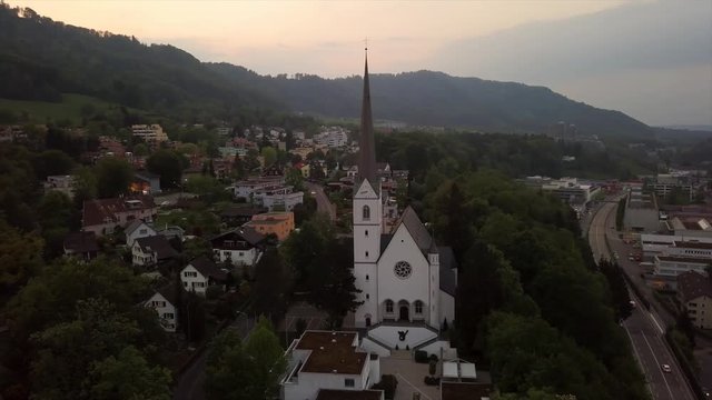 sunset time adliswil town church aerial panorama 4k switzerland
