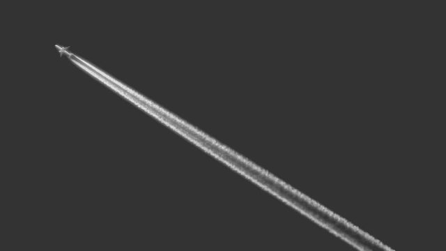 The plane isolated on a gray background flies up. Air jet flying fast.