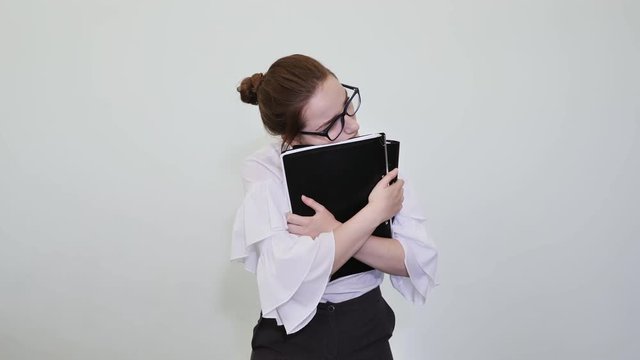 A schoolgirl in glasses depicts a successful girl with notes. A student depicts a reverie. The solution of the problem.