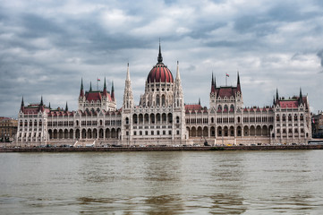 Fototapeta na wymiar Hungarian Parliament on the embankment of Danube river in Budapest, Hungary