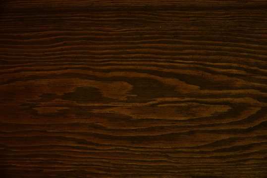 Fototapeta Dark brown wooden texture.