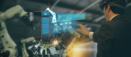 iot industry 4.0 concept,industrial engineer(blurred) using smart glasses with augmented mixed with...