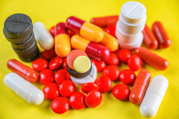 medical pills on a yellow background